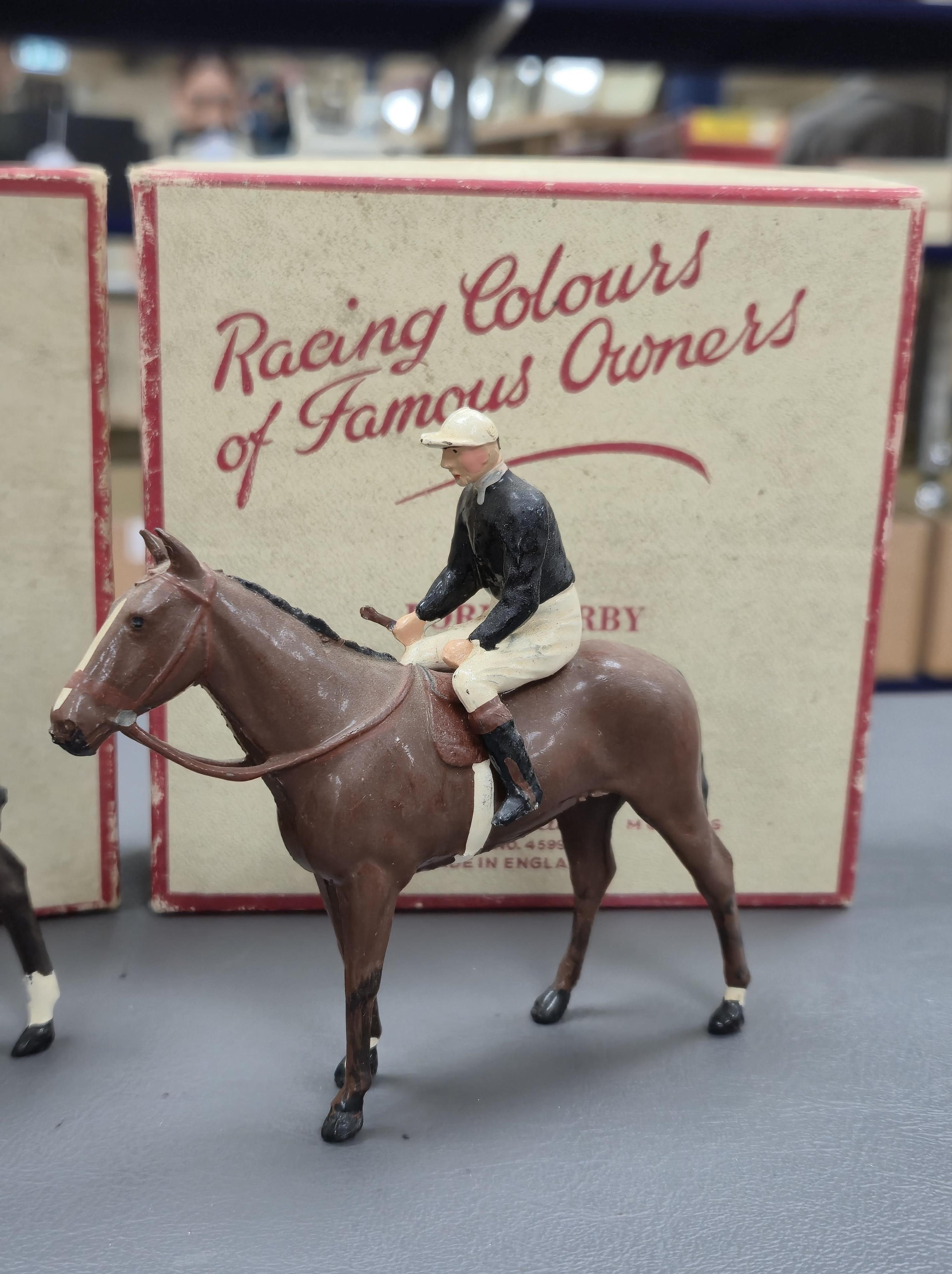 Two boxed Britains Racing Colours of Famous Owners series lead mounted figures; Lord Derby - rider in black jersey with a white cap on a brown horse, and Mr. H. J. Joel - rider in black jersey with red cap on a dark brow